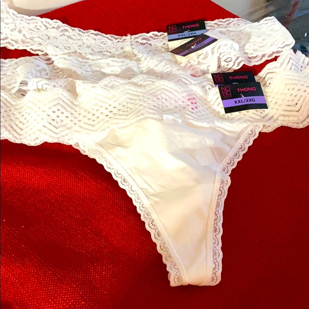 This is 4 pair of white lace thongs